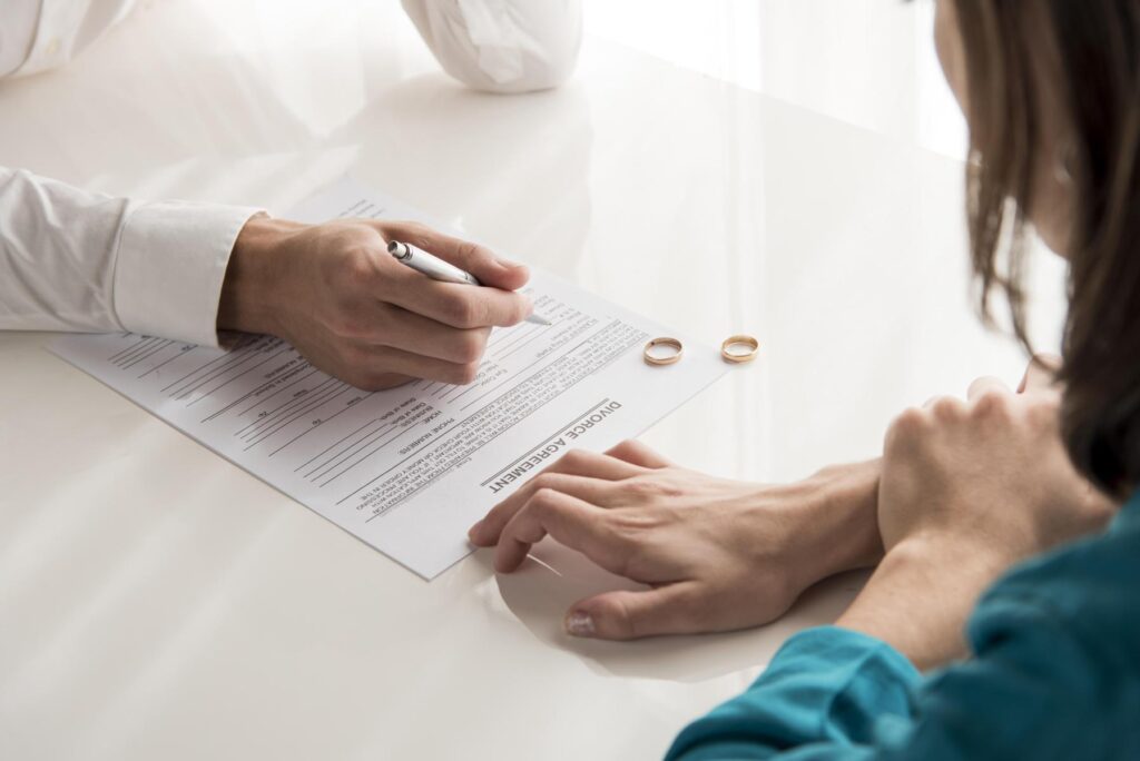 Divorce Document Assistance Couple signing divorce